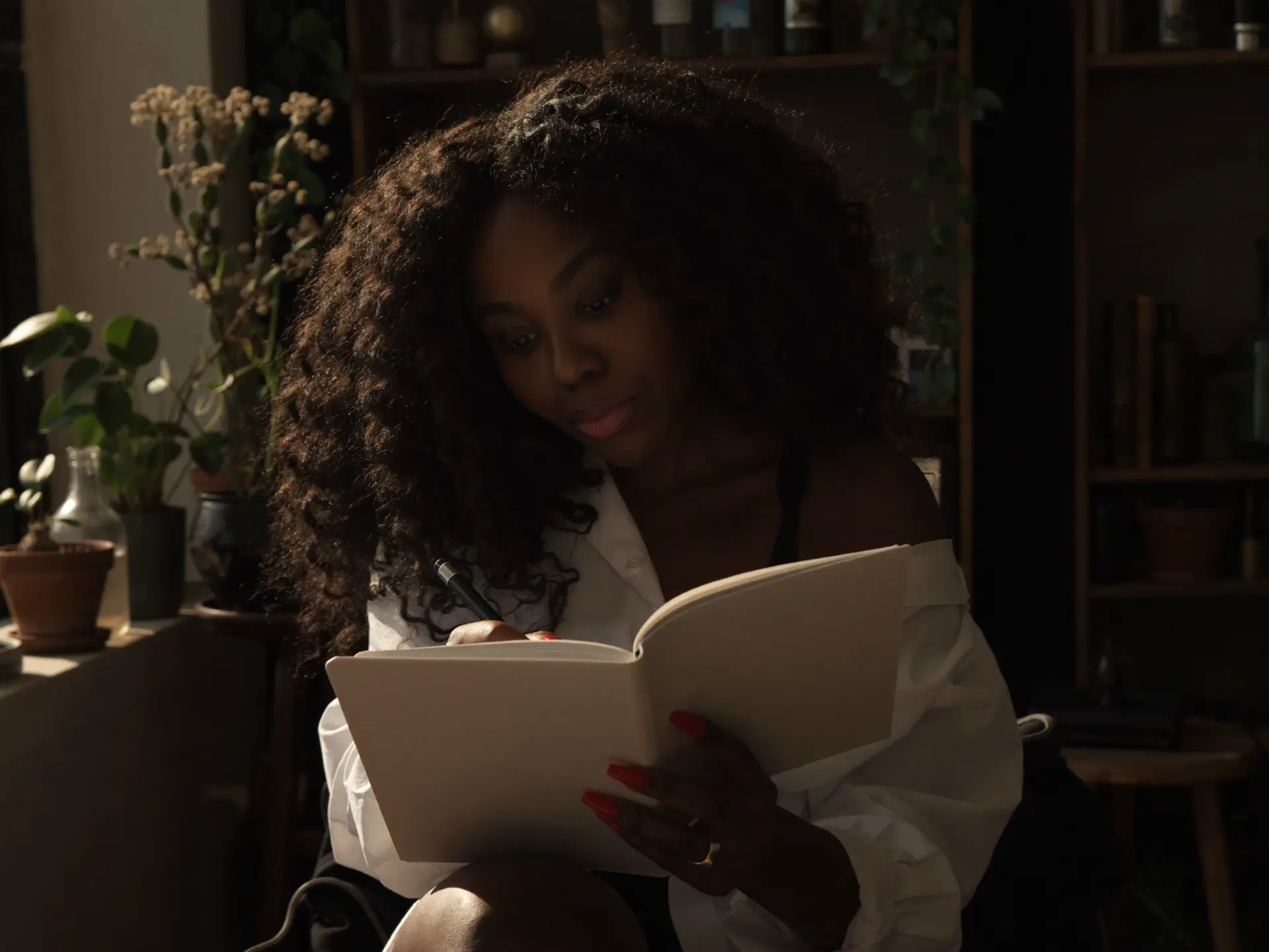 NSTASIA, singer-songwriter and creator of Ambitionary, in her studio